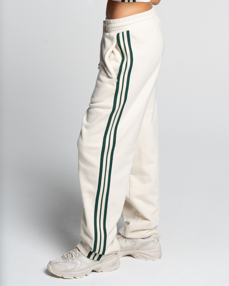 Green and white track pants on sale